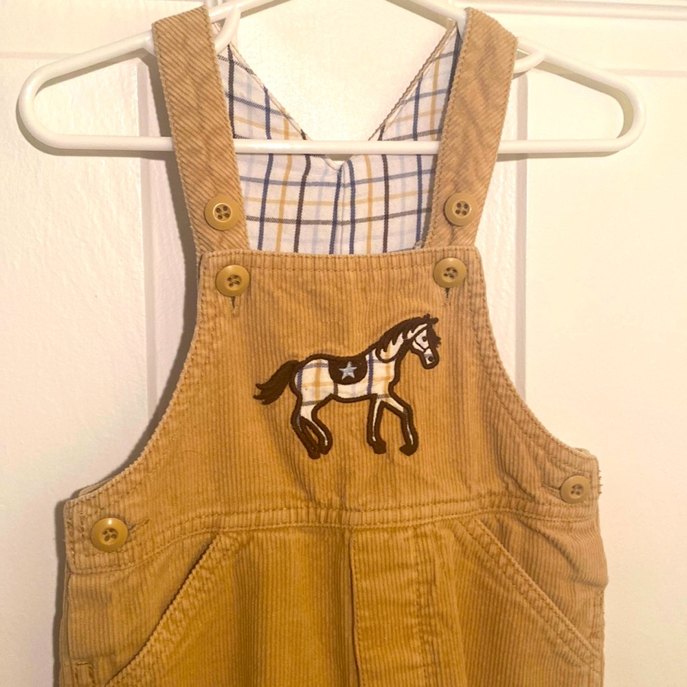 Boys Kitestring corduroy overalls. Tan with pony appliqué. Size 2T.